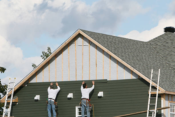 Professional Storm Damage Siding Repair technician working in Burlington, OH
